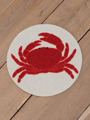 Round placemat with red beaded crab