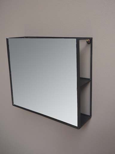 Mirror with secret shelf