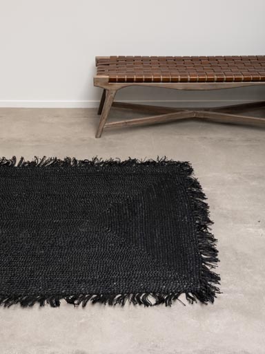 Braided black hemp rug with tassels