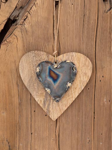 Metal heart on wooden heart