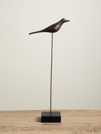 Sculpted bird on iron rod
