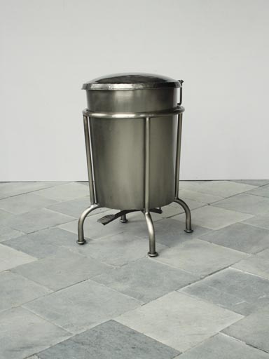 Metal dustbin on stand.