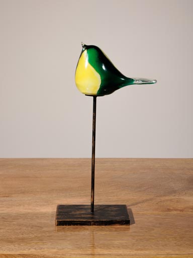 Oiseau jaune et vert en verre sur pied