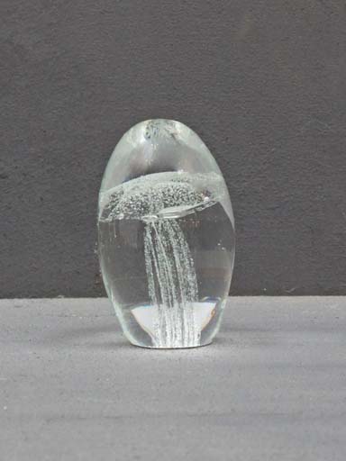 Glass paperweight w/ white jellyfish.