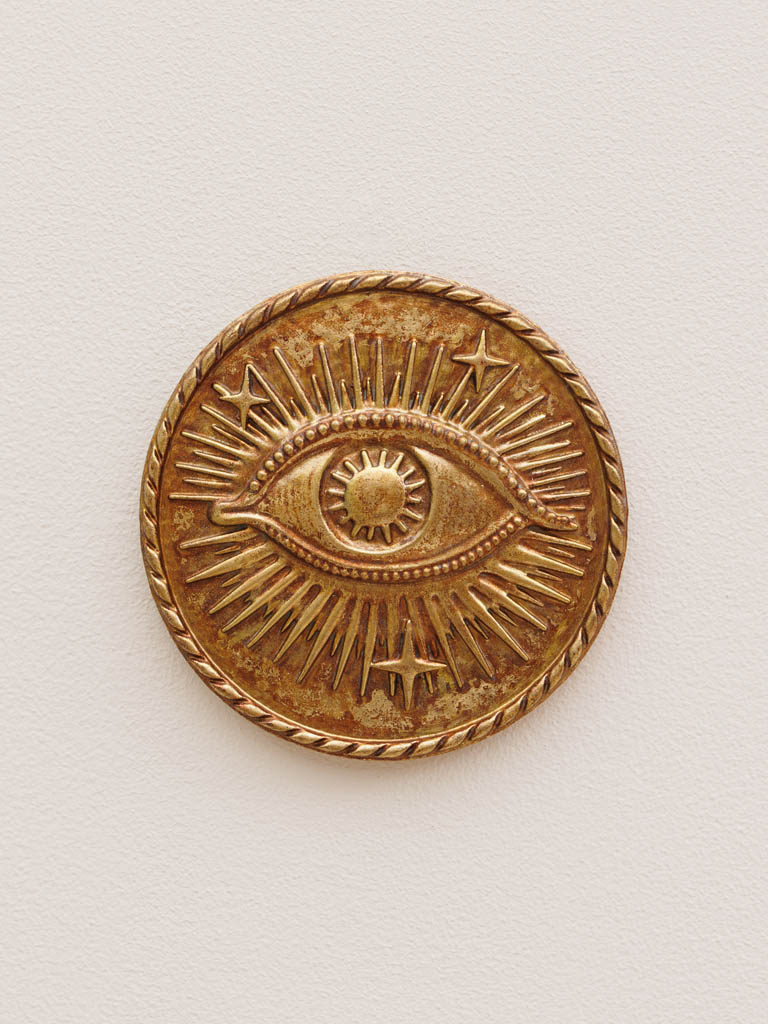 Starry eye on golden wall medallion - 1