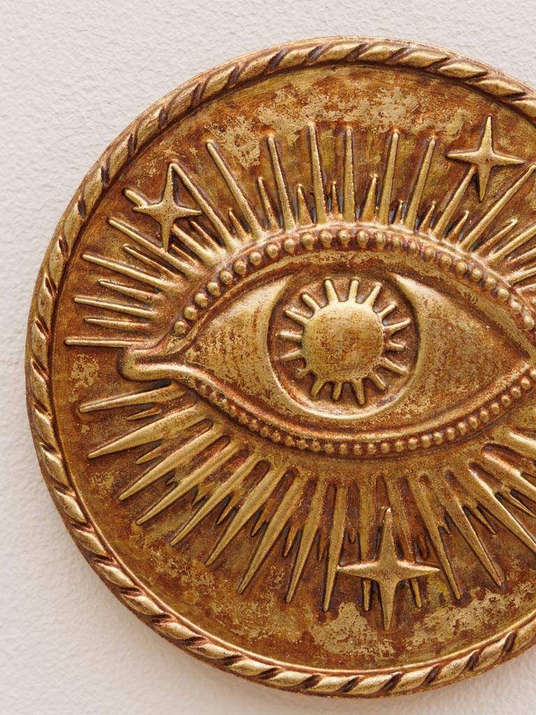 Starry eye on golden wall medallion - 3