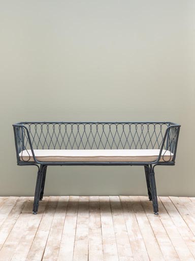 Twisted blue iron bench with beige cushion