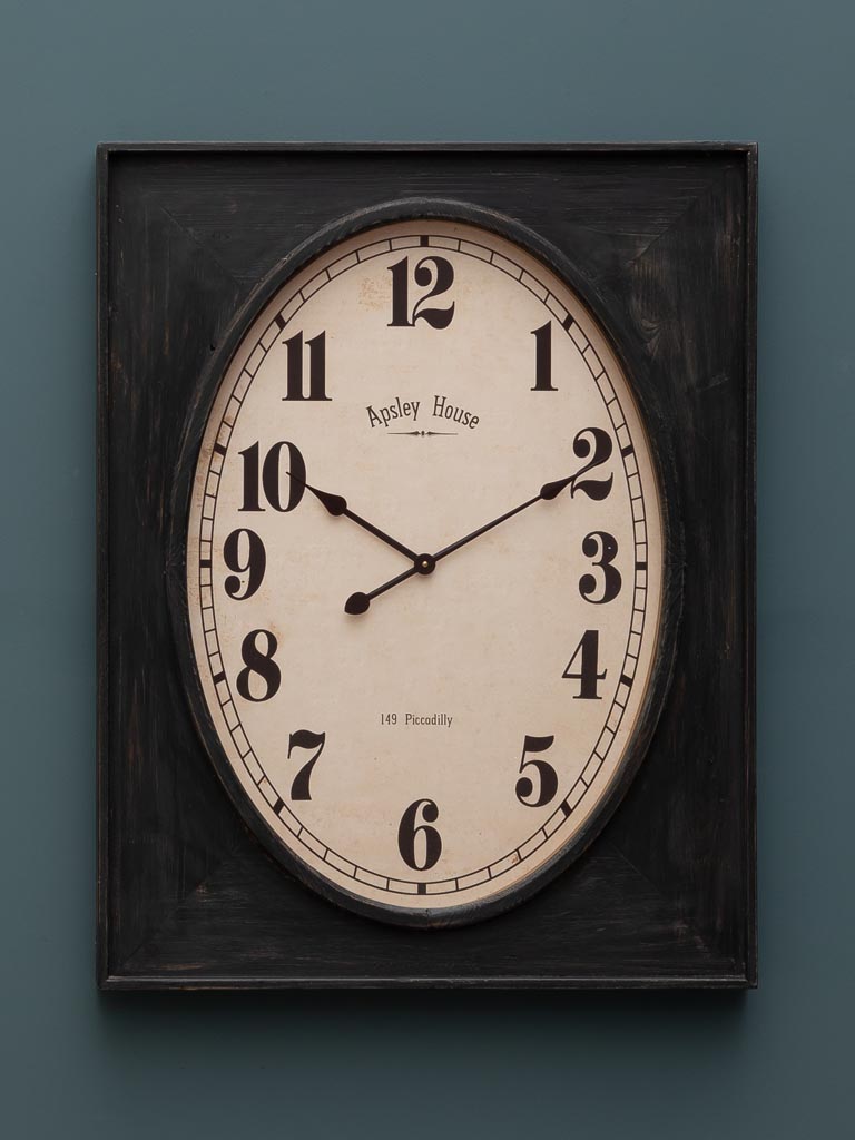 Oval clock in rectangular frame - 1
