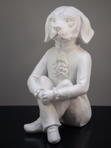 Sitting dog in ceramic
