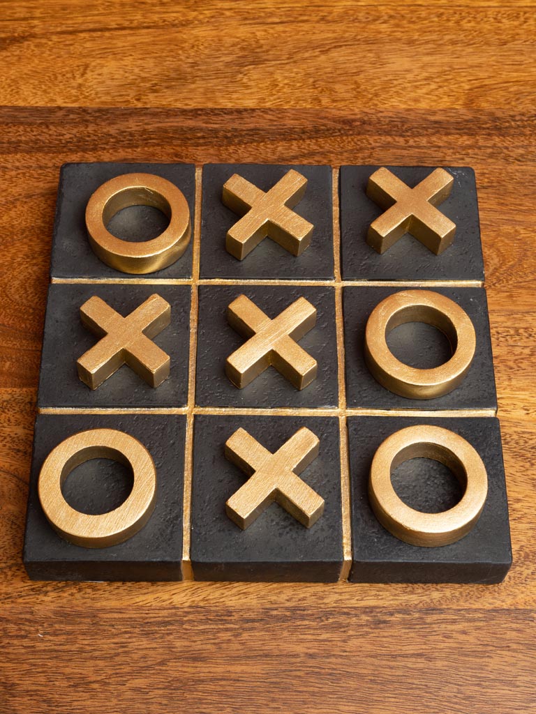 Tic tac toe godlen game on concrete base - 1