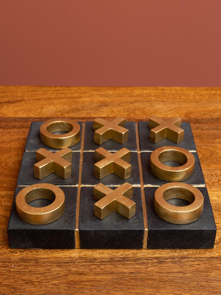 Tic tac toe godlen game on concrete base - 3