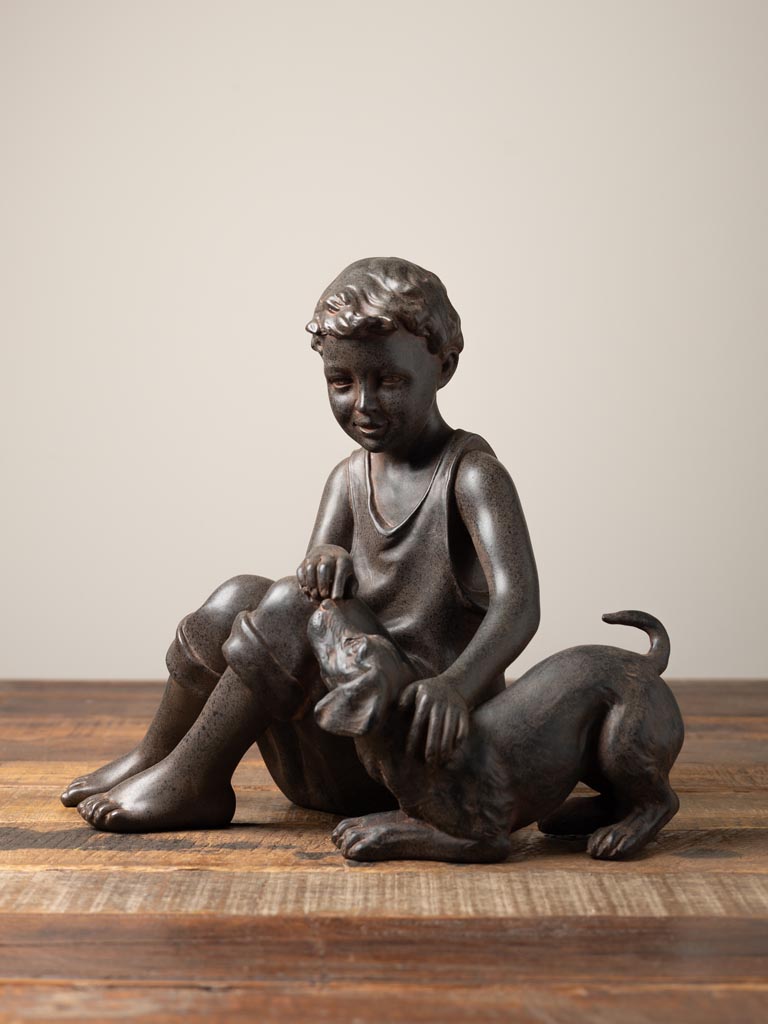 Seated boy with dogn in resin - 1