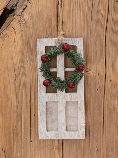 Porte blanche et couronne de Noël