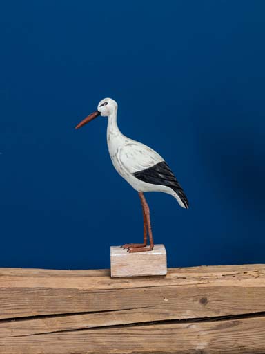 Wooden standing stork on base