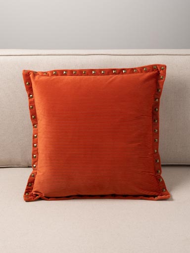 Orange corduroy cushion with studs