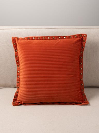 Coussin velours côtelé orange et clous