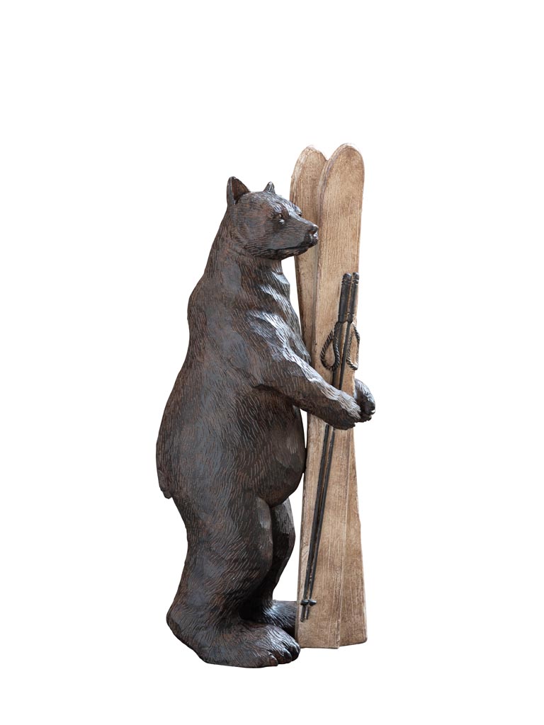 Bear holding skis - 2