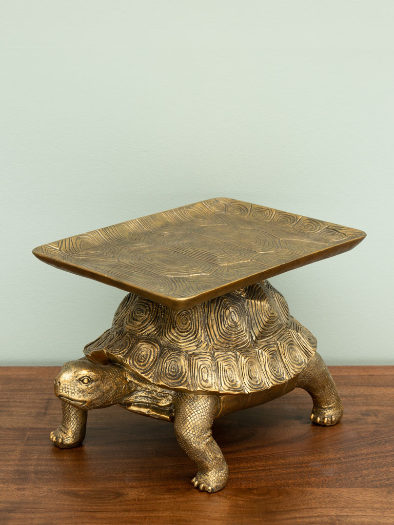 Tortue dorée portant un plateau - 1