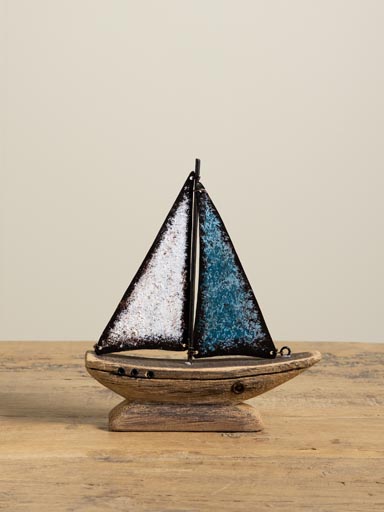 Small boat with blue iron sail