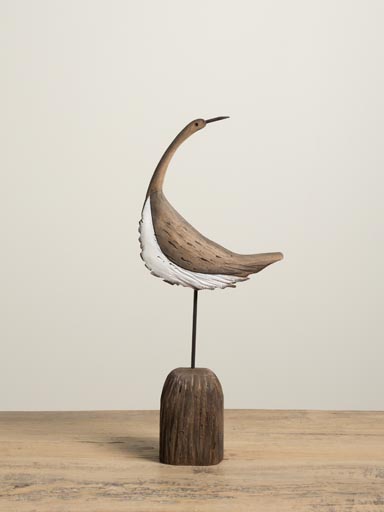 Curved bird on log