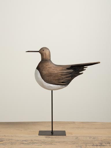 Brown bird on iron base