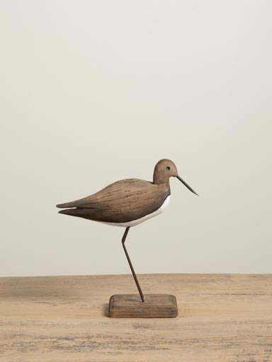 Woodcock bird on wooden base