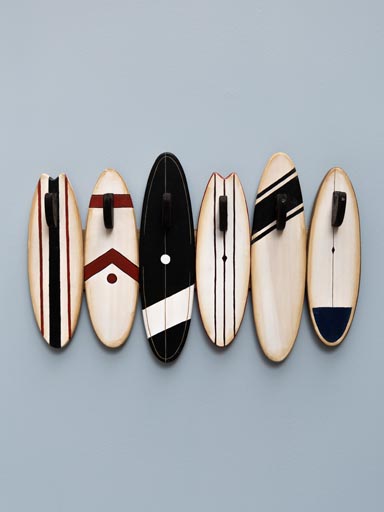 Vintage surf boards with wooden hooks