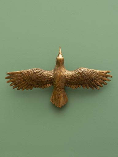 Wall flying golden bird