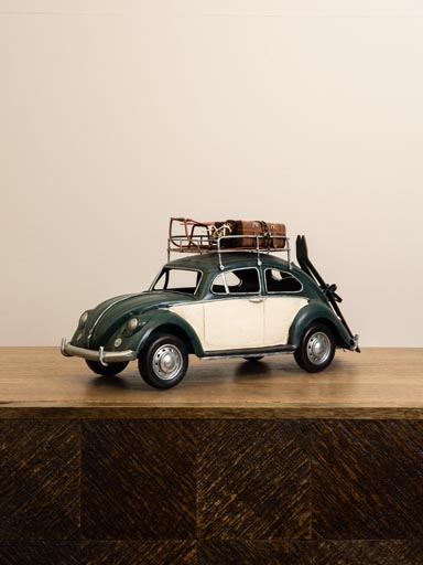 Green beetle car with skis