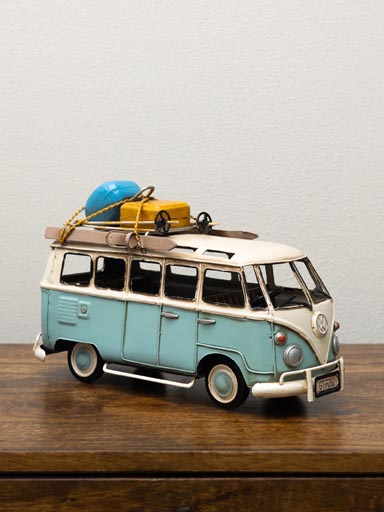 Light blue VW van with skis